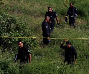 Municipal police work at the area where the civil organization “Search Mothers” of Jalisco located a clandestine crematorium with human remains in a ravine in Tlaquepaque, State of Jalisco, Mexico, on October 15, 2023.