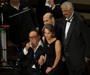 Mexican comedian Roberto Gomez Bolanos, popularly known as Chespirito, left, attends an event in his honor at the National Auditorium in Mexico City, Wednesday Feb. 29, 2012. The Chavo del Ocho show, created by Gomez Bolanos, is popular throughout Latin America and is still being aired in reruns in Mexico. From right, Ruben Aguirre, who played the character of 'El senor Jirafales' in the show, Edgar Vivar who played the character of 'El senor Barriga' and Florinda Meza, Gomez Bolanos' wife, who played the character of 'Dona Florinda.' (AP Photo/Eduardo Verdugo)