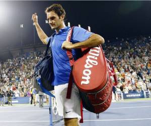 (FILES) In this file photo Switzerland's Roger Federer plays a return to Spain's Rafael Nadal during their tennis match at The Match in Africa at the Cape Town Stadium, in Cape Town on February 7, 2020. - Defending champion Roger Federer has withdrawn from this month's Miami Open as he works his way back to full fitness following surgeries to repair his right knee, US media reported on March 1, 2021. The 39-year-old Swiss star, who has not played since losing in the semi-finals of last year's Australian Open, is due to make his return from a year-long layoff at the Qatar Open in Doha next week. (Photo by RODGER BOSCH / AFP)