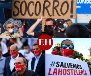 Cientos de trabajadores de los sectores de restaurantes y los locales nocturnos, duramente golpeados por la pandemia del coronavirus, se concentraron en Madrid este miércoles para pedir 'socorro' y afirmar que 'el ocio nocturno también tiene el derecho de trabajar'. Fotos AFP.