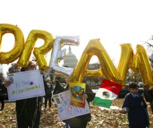 In this Dec. 6, 2017, file photo, demonstrators hold up balloons during an immigration rally in support of the Deferred Action for Childhood Arrivals (DACA), and Temporary Protected Status (TPS), programs, near the U.S. Capitol in Washington. (AP Photo/Jose Luis Magana, File)