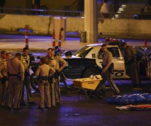 Las Vegas police gather following a deadly shooter at a music festival Monday, Oct. 2, 2017, in Las Vegas. (Chase Stevens/Las Vegas Review-Journal via AP)