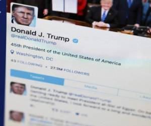 FILE- This April 3, 2017, photo shows President Donald Trump's tweeter feed on a computer screen in Washington. Some Twitter users say Trump is violating the First Amendment by blocking people from his feed after they posted scornful comments. Lawyers for two Twitter users sent the White House a letter Tuesday, June 6, demanding they be un-blocked from the Republican president’s @realDonaldTrump account. (AP Photo/J. David Ake, File)