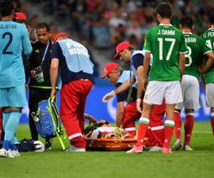 Mexico's defender Carlos Salcedo lies on a stretcher after being injured during the 2017 Confederations Cup group A football match between Mexico and New Zealand at the Fisht Stadium in Sochi on June 21, 2017. / AFP PHOTO / Yuri CORTEZ
