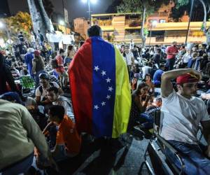 Las protestas estallaron luego de que TSJ tomara temporalmente las funciones del Parlamento. Aunque revirtió la decisión tras rechazo internacional, se desató la actual ola de protestas, que ha traído a la memoria las manifestaciones de 2014 que dejaron 43 muertos, foto: Agencia AFP.