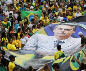 Como candidatos, los Bolsonaro hicieron campañas con una agenda anticorrupción y criticaron dichas protecciones. (Foto: AP)