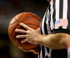 (FILES) In this file photo a detail shot of a referee holding a ball during the second round of the 2014 Men's ACC Basketball Tournament at Greensboro Coliseum on March 13, 2014 in Greensboro, North Carolina. - NBA suspends the regular season after a case of coronavirus in a player (official) (Photo by STREETER LECKA / GETTY IMAGES NORTH AMERICA / AFP)