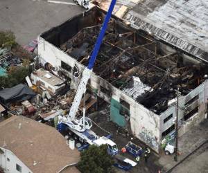 Las labores de búsqueda fueron interrumpidas por un problema en la estructura del depósito (Foto: AFP/ El Heraldo Honduras/ Noticias de Honduras)