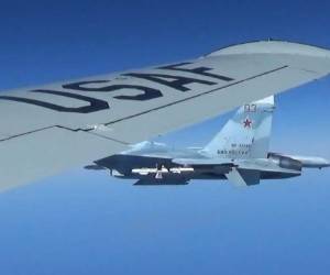 This image released by the US European Command (EUCOM) shows a Russian SU-27 Flanker fighter plane photographed from a US Air Force reconnaissance jet on June 19, 2017, over the Baltic Sea. EUCOM reported in the release, the Russian fighter flew within a few feet of the US plane and because of the 'high rate of closure speed and poor control of the aircraft during the intercept, this interaction was determined to be unsafe.' / AFP PHOTO / US European Command / Master Sgt. Charles Larkin Sr / RESTRICTED TO EDITORIAL USE - MANDATORY CREDIT 'AFP PHOTO / US European Command Public / Master Sgt. Charles Larkin, Sr.' - NO MARKETING NO ADVERTISING CAMPAIGNS - DISTRIBUTED AS A SERVICE TO CLIENTS