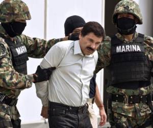 (FILES) In this file photo taken on January 19, 2017 This handout picture released by the Mexican Interior Ministry on January 19, 2017 shows Joaquin Guzman Loera aka 'El Chapo' Guzman (C) escorted in Ciudad Juarez by the Mexican police as he is extradited to the United States. - After a dramatic decades-long run as one of the world's most notorious druglords, there is little suspense about what will happen in a New York courtroom on Wednesday: Joaquin 'El Chapo' Guzman is expected to be sentenced to life in prison. (Photo by HO / INTERIOR MINISTRY OF MEXICO / AFP) / RESTRICTED TO EDITORIAL USE-MANDATORY CREDIT 'AFP PHOTO/INTERIOR MINISTRY OF MEXICO' NO MARKETING NO ADVERTISING CAMPAIGNS-DISTRIBUTED AS A SERVICE TO CLIENTS-XGTY / TO GO WITH AFP STORY BY Laura BONILLA CAL: 'El Chapo expected to get life sentence from US judge' Pixelation of faces was done by the US Department of Justice