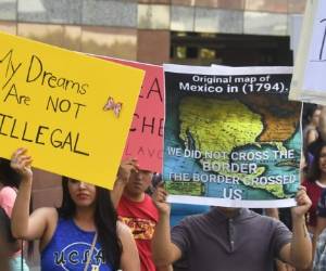 A map of Mexico as it was in 1794 is displayed as young immigrants and their supporters rally in support of Deferred Action for Childhood Arrivals (DACA) in Los Angeles, California on September 1, 2017.A decision is expected in coming days on whether US President Trump will end the program by his predecessor, former President Obama, on DACA which has protected some 800,000 undocumented immigrants, also known as Dreamers, since 2012. / AFP PHOTO / FREDERIC J. BROWN