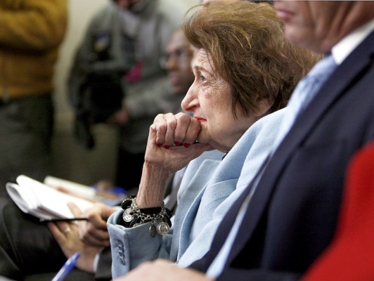 FILE - In this Feb. 25, 2009, file photo veteran White House correspondent Helen Thomas listens as White House Press Secretary Robert Gibbs answers her question during his daily press briefing in Washington. Thomas, the irrepressible White House correspondent who used her center, front row seat of history to grill 10 presidents, died Saturday, July 20, 2013, at the age of 92. She pushed open the doors for women at the White House Correspondents' Association dinner, when at her urging, President John F. Kennedy refused to attend the 1962 dinner unless it was open to women for the first time. Thomas fought, too, for a more open presidency, resisting all moves by a succession of administrations to restrict press access. 'People will never know how hard it is to get information,' she told an interviewer, 'especially if it's locked up behind official doors where, if politicians had their way, they'd stamp TOP SECRET on the color of the walls.' (AP Photo/Charles Dharapak, File)