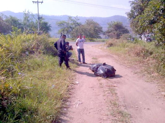 En bolsas plásticas hallan cuerpos de dos hombres en el norte de Honduras
