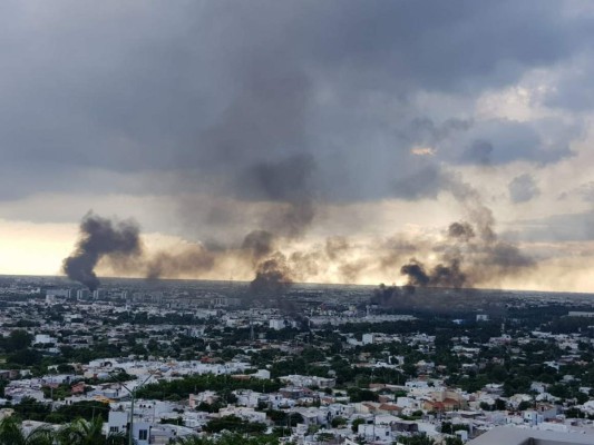 Balaceras, incendios y caos: las fotos por la captura del hijo de 'El Chapo'