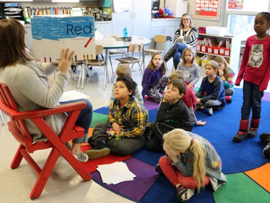 MADISON, WIS. -- JANUARY 04: Teacher Erin Vogel reads 'Red: A Crayon's Story' to her second-grade class on Thursday, Jan. 4, 2018, at Crestwood Elementary School in Madison, Wis. The book â°?? about a red crayon who can't help but color in blue â°?? is part of a session that adapts the Welcoming Schools program, a Human Rights Campaign-backed effort to teach gender equality and empathy in an age-appropriate way at elementary schools throughout the Madison Metropolitan School District. â°??We are raising a generation of boys who see girls as equals,' Ms. Vogel says. '??And we're hoping they'??ll grow into men who understand that women have the same rights and deserve the same respect they do.' PHOTO: Jessica Mendoza/The Christian Science Monitor