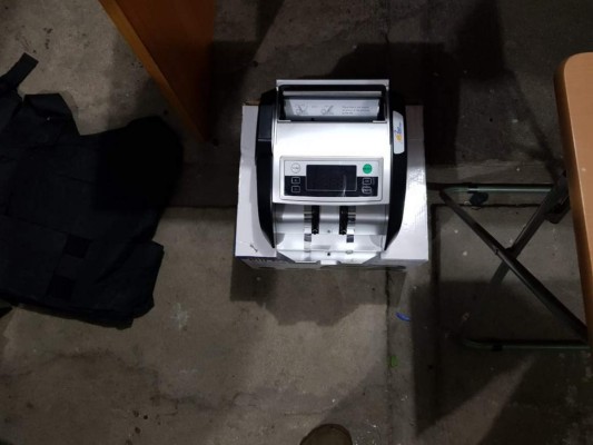 Detienen a administradora y a cabecilla de la pandilla 18 con un arsenal en San Pedro Sula