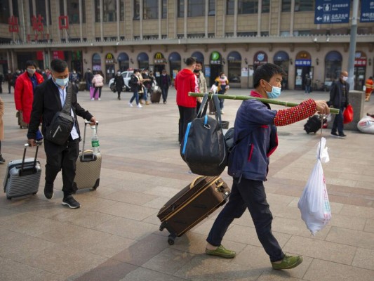 FOTOS: China empieza a retirar restricciones en centro de epidemia 