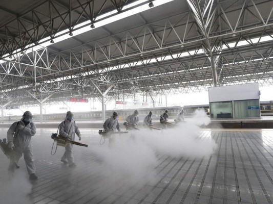 FOTOS: China empieza a retirar restricciones en centro de epidemia 