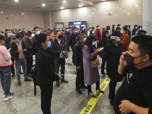 FOTOS: China empieza a retirar restricciones en centro de epidemia 