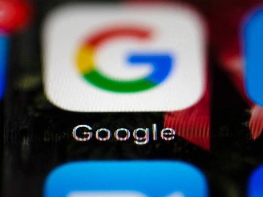FILE- This April 26, 2017, file photo shows a Google icon on a mobile phone in Philadelphia. Google is spearheading an educational campaign to teach pre-teen children how to protect themselves from scams, predators and other trouble. The program announced Tuesday, June 6, is called “Be Internet Aware.” (AP Photo/Matt Rourke, File)
