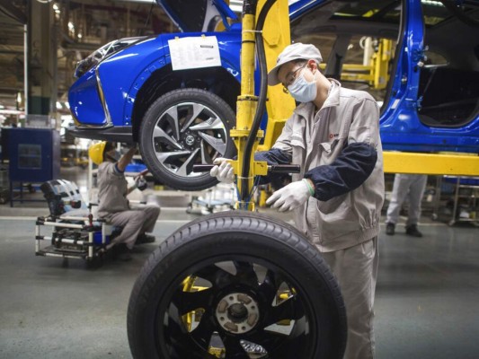 FOTOS: China empieza a retirar restricciones en centro de epidemia 