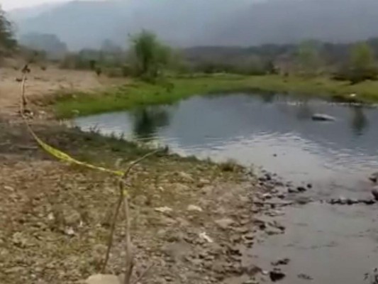 Atado de pies y manos hallan cadáver de hombre en el río Chamelecón