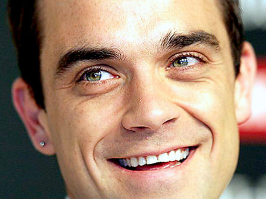 El cantante británico Robbie Williams, padre de una niña