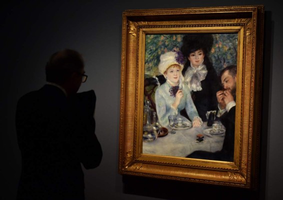 A man looks at French painter Pierre-Auguste Renoir's painting 'After the Lunch' during the exhibition titled 'Intimacy' of French painter Pierre-Auguste Renoir at the Thyssen-Bornemisza museum in Madrid on October 17, 2016.The exhibition will run from October 18, 2016 to January 22, 2017. / AFP PHOTO / GERARD JULIEN / RESTRICTED TO EDITORIAL USE - MANDATORY MENTION OF THE ARTIST UPON PUBLICATION - TO ILLUSTRATE THE EVENT AS SPECIFIED IN THE CAPTION