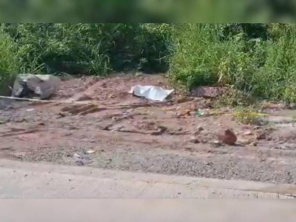 Los restos de la fémina estaba a la orilla de la calle, en la carretera a Danlí.