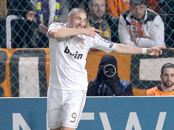 Real Madrid's Karim Benzema reacts after scoring the third goal against APOEL during a Champions League quarterfinal soccer match at GSP stadium in Nicosia, on Tuesday, March 27, 2012. Real Madrid won 3-0. (AP Photo/Thanassis Stavrakis)