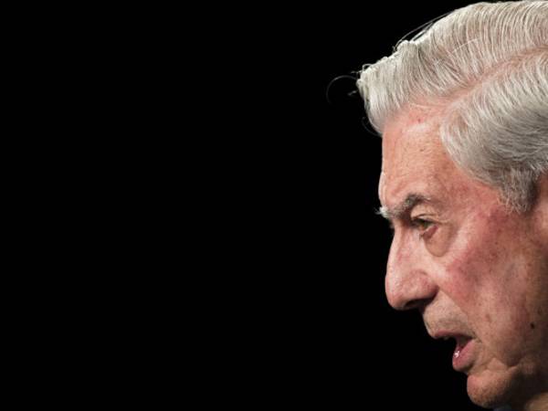 Peruvian writer and Nobel Prize winner in literature Mario Vargas Llosa speaks during a meeting Spain, Thursday, July 3, 2013, where intellectuals, journalists and politicians from America and Europe gathered to discuss media freedom in Latin America. (AP Photo/Daniel Ochoa de Olza)