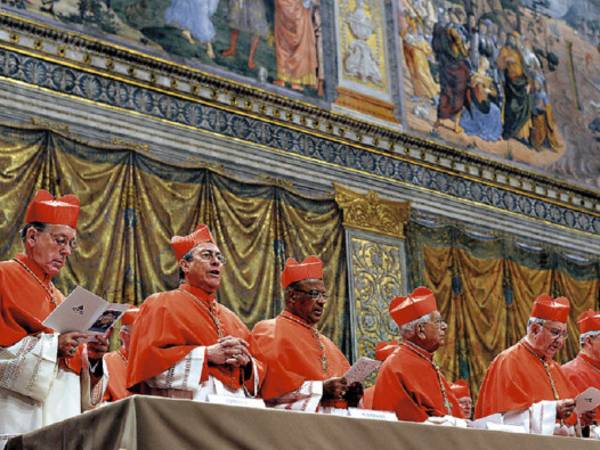 This handout picture released by the Press office shows cardinals chanting the Latin hymn 'Veni Creator Spiritus' ('Come Creator Spirit') in the Sistine Chapel before the start of the conclave at the Vatican on March 12, 2013. Cardinals moved into the Vatican today as the suspense mounted ahead of a secret papal election with no clear frontrunner to steer the Catholic world through troubled waters after Benedict XVI's historic resignation. The 115 cardinal electors who pick the next leader of 1.2 billion Catholics in a conclave in the Sistine Chapel will live inside the Vatican walls completely cut off from the outside world until they have made their choice. AFP PHOTO/OSSERVATORE ROMANORESTRICTED TO EDITORIAL USE - MANDATORY CREDIT ?AFP PHOTO/OSSERVATORE ROMANO'