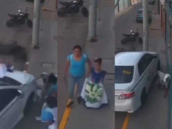 Tras el impacto, uno de los ocupantes de la motocicleta quedó cerca de la acera y del taxi, mientras que el otro terminó tendido sobre el pavimento.
