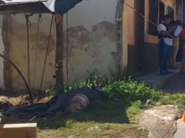 El cuerpo quedó en medio del garaje de una vivienda.