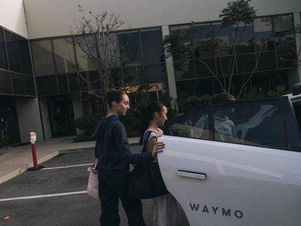 HEADLINE: A New Role for Robot Cars CAPTION: Two teenagers use a Waymo to get home from lunch in Los Angeles, Dec. 13, 2025. Los Angeles families with busy schedules are summoning self-driving cars to cart their children around. CREDIT: (Mark Abramson/The New York Times)