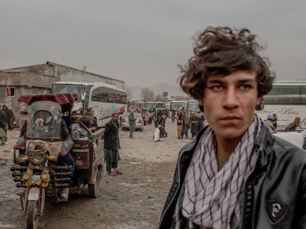 A depot in Kabul, Afghanistan, where buses depart to take Highway 1 to Kandahar and Herat, on Dec. 13, 2025. Since the Taliban repaved Highway 1, buses can now complete the trip to Kandahar in six to eight hours, down from 18 during the war. (Tomas Munita/The New York Times)