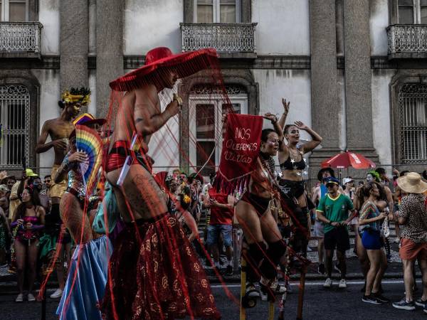 Performers walk along a street during the Boi Tolo in Rio de Janeiro, Feb. 15, 2026. The Boi Tolo, one of the city’s most iconic street parties, has come to represent the glittery, gritty grass-roots celebration far from the glamour of the official parades.