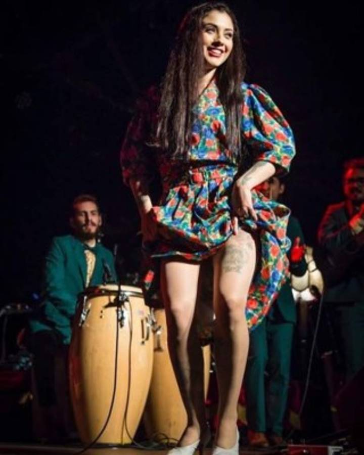 Chilean singer Mon Laferte performs during 'Tiempo de Mujeres' concert at Zocalo square in Mexico City, on March 7,2020. (Photo by Consuelo REYES / AFP)