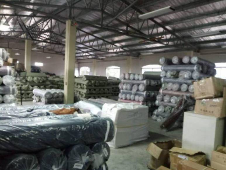 Viviendas, empresa textil y talleres: los bienes incautados a presunto narco en Cortés