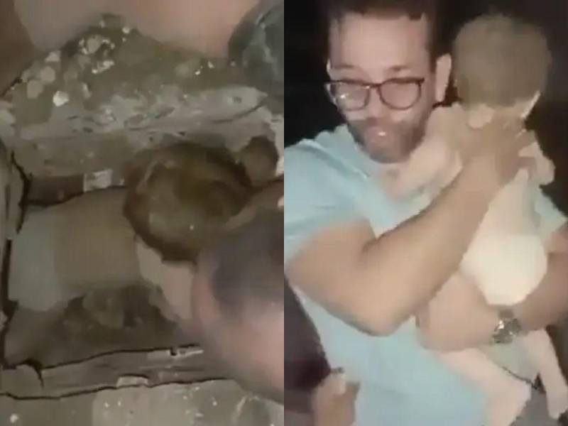 Momento en que la bebé sale de los escombros siguiendo la voz de su padre y es rescatada.