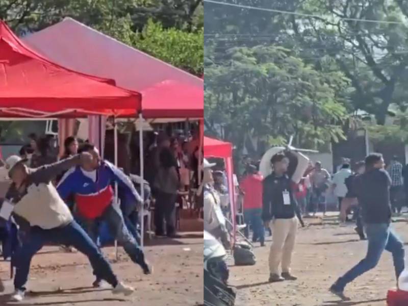 Los militantes de Libre y el Partido Liberal empezaron a lanzar piedras a la carpa donde se encontraban los representantes del Partido Nacional en el CLE.