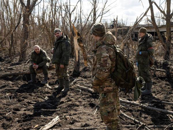 FILE Ñ Russian forces search for bodies of soldiers and civilians in Cherkasskoye Porechnoye, western Russia, March 20, 2025. As many as 325,000 of the countryÕs troops have died on the battlefield. (Nanna Heitmann/The New York Times)