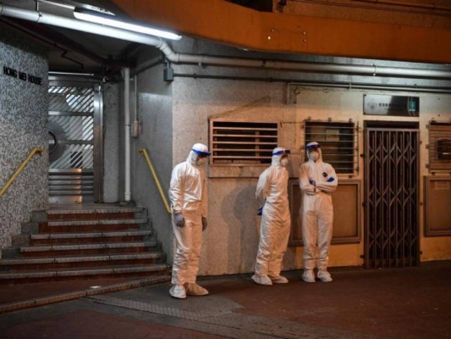 FOTOS: Rigurosa inspección en Hong Kong tras infección en cena familiar