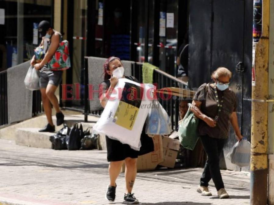 Capitalinos procuran 'normalizar' sus vidas en medio de pandemia y huracanes (FOTOS)