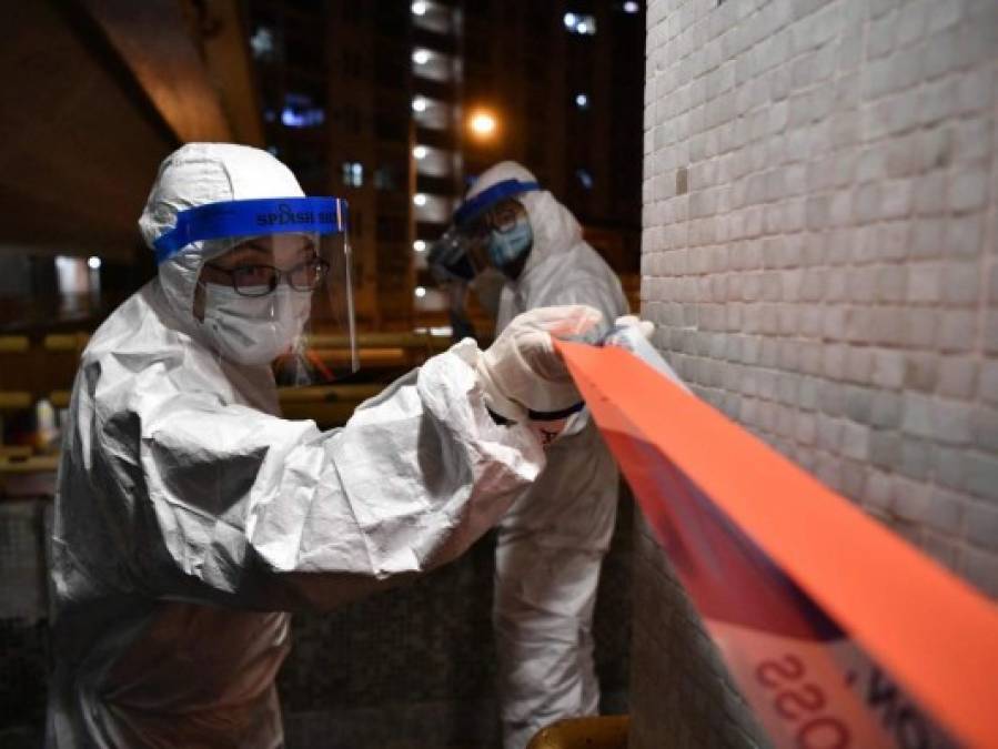 FOTOS: Rigurosa inspección en Hong Kong tras infección en cena familiar