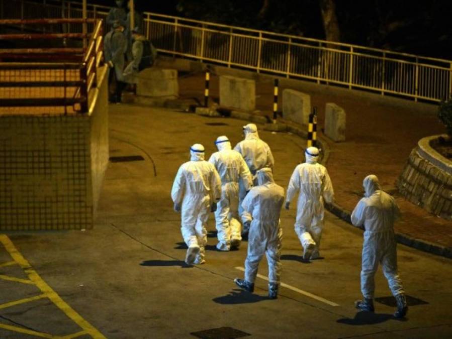 FOTOS: Rigurosa inspección en Hong Kong tras infección en cena familiar