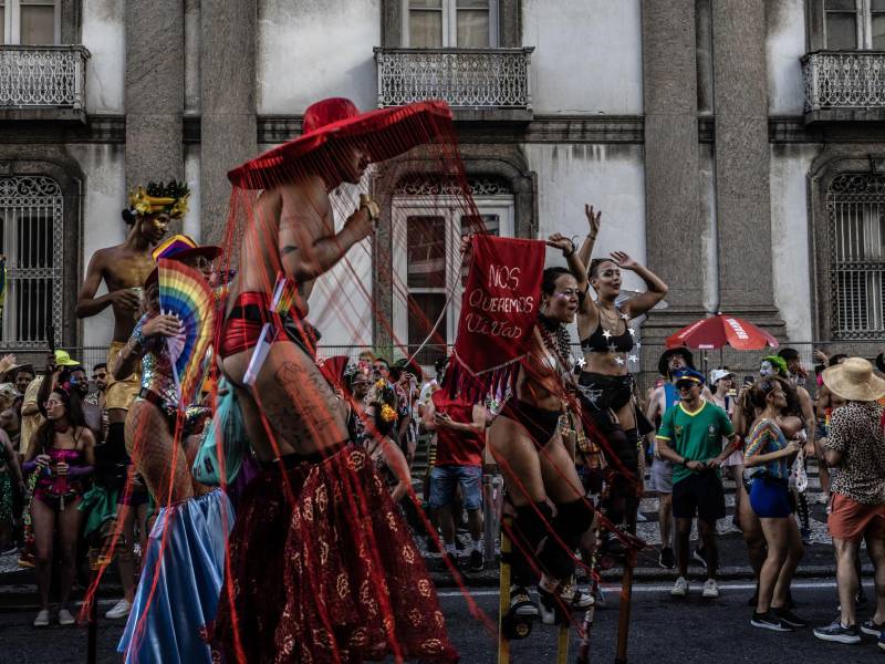 Performers walk along a street during the Boi Tolo in Rio de Janeiro, Feb. 15, 2026. The Boi Tolo, one of the city’s most iconic street parties, has come to represent the glittery, gritty grass-roots celebration far from the glamour of the official parades.