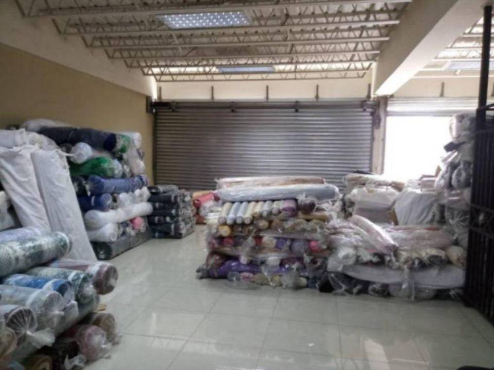 Viviendas, empresa textil y talleres: los bienes incautados a presunto narco en Cortés