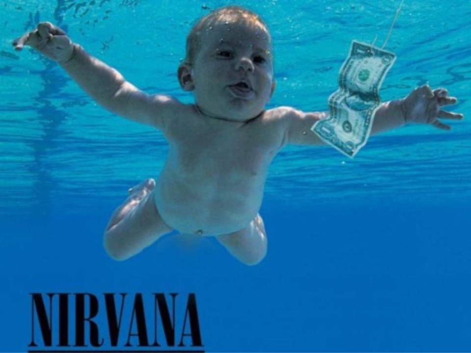 Fotografiado en 1991 a la edad de cuatro meses, Elden aparece desnudo en una piscina en la portada de Nevermind, con la mirada clavada en un billete de un dólar colgado en un gancho.